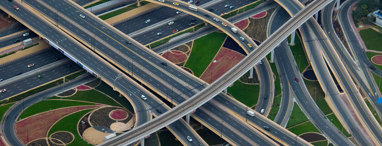 View of a complex highway intersection with cars driving on it